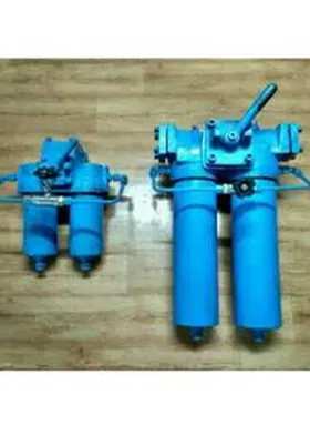Two blue duplex strainers with dual cylindrical filter housings and manual lever valves, designed for continuous fluid filtration in industrial systems.