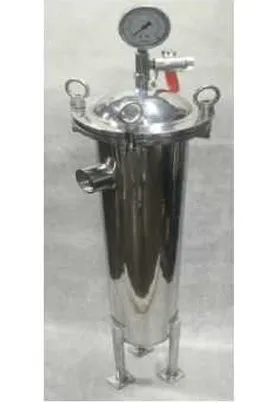 Stainless steel bag filter housing with a pressure gauge and inlet/outlet ports, mounted on legs, used for high-capacity industrial liquid filtration.
