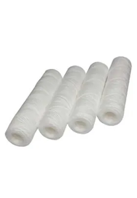 Four white cartridge filters with cylindrical, tightly wound thread-like construction, designed for fine filtration in water purification and fluid processing systems.