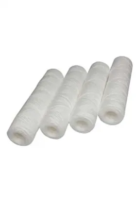 Four white string wound filter cartridges arranged in a row, designed for liquid filtration in industrial or residential water purification systems.