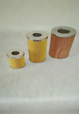 Three cylindrical oil filters of varying sizes with pleated paper elements and metal end caps, designed for removing contaminants from engine or hydraulic oil.